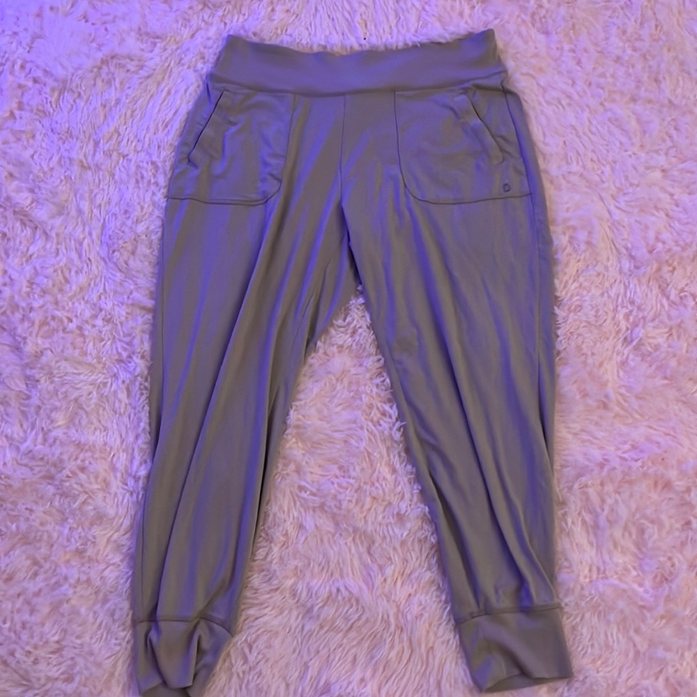 Cream colored joggers. Super stretchy. Has pockets. No adjustable strings.